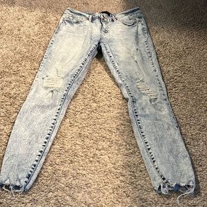 Mid rise light washed distressed skinny